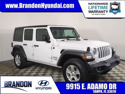 2019 Jeep Wrangler Unlimited Sport S in White — front three-quarter view