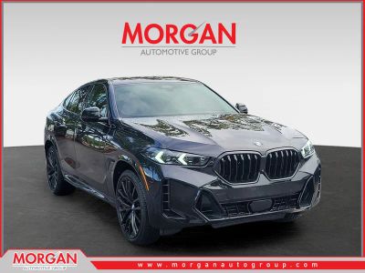 2026 BMW X6 xDrive40i in Black Sapphire Metallic — front three-quarter view