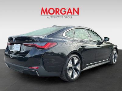 2026 BMW i4 — rear three-quarter view