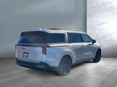 2026 Kia Carnival Hybrid — rear three-quarter view