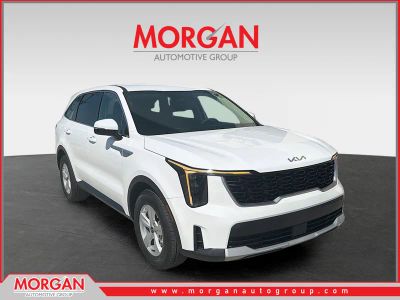 2025 Kia Sorento LX in Glacial White Pearl — front three-quarter view