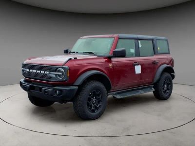 2026 Ford Bronco Badlands in Ruby Red Metallic — front three-quarter view