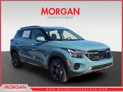 2026 Kia Seltos EX in Pluton Blue — front three-quarter view