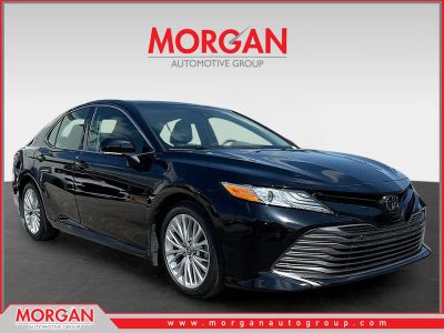 2018 Toyota Camry XLE in Midnight Black Metallic — front three-quarter view