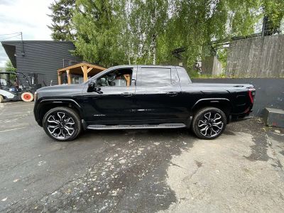 2025 GMC Sierra EV — rear three-quarter view