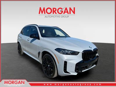 2025 BMW X5 M60i in Brooklyn Grey Metallic — front three-quarter view