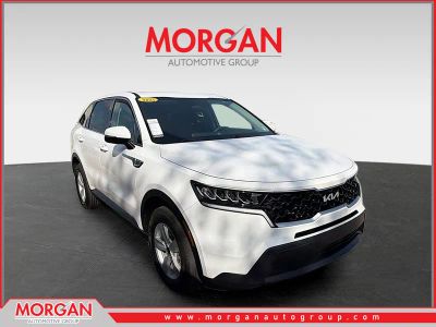 2023 Kia Sorento LX in Glacial White Pearl — front three-quarter view