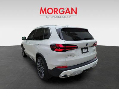 2026 BMW X5 — rear three-quarter view