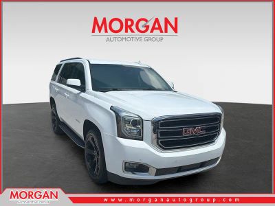 2019 GMC Yukon SLE in Summit White — front three-quarter view