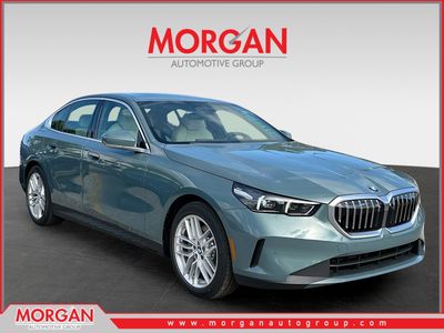 2025 BMW 5 Series 530i in Cape York Green Metallic — front three-quarter view