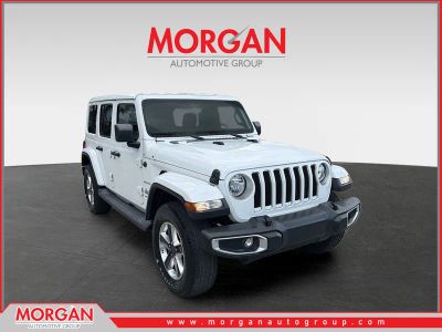 2019 Jeep Wrangler Unlimited Sahara in Bright White Clearcoat — front three-quarter view