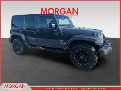 2017 Jeep Wrangler Unlimited Sahara in Gray — front three-quarter view