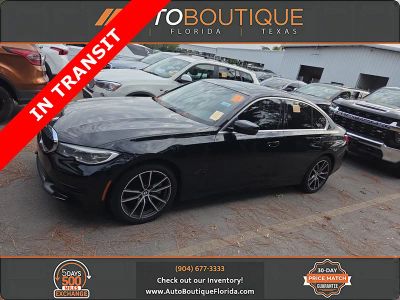 2021 BMW 3 Series 330i in Jet Black — front three-quarter view