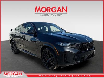 2027 BMW X6 M60i in Black Sapphire Metallic — front three-quarter view
