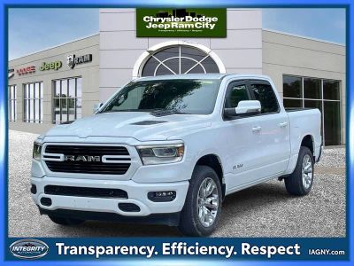 2023 RAM 1500 Laramie Crew Cab 4x4 5'7' Box in Bright White Clearcoat — front three-quarter view