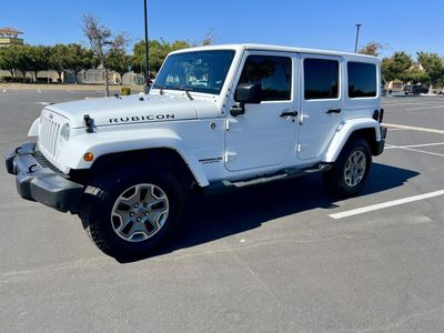 2015 Jeep Wrangler-Unlimited in White — front three-quarter view