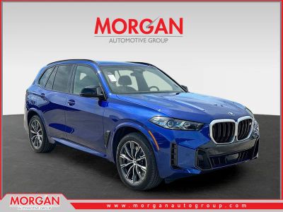 2026 BMW X5 M60i in Blue Metallic — front three-quarter view