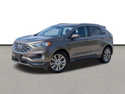 2019 Ford Edge Titanium in Stone Gray Metallic — front three-quarter view