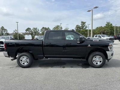 2026 RAM 2500 Tradesman in Diamond Black Crystal Pearlcoat — front three-quarter view