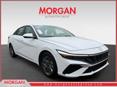 2024 Hyundai Elantra SEL in White — front three-quarter view
