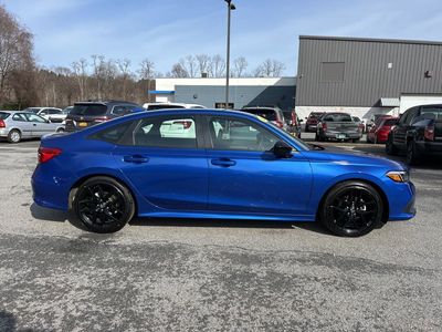 2024 Honda Civic Sedan Sport CVT — rear three-quarter view