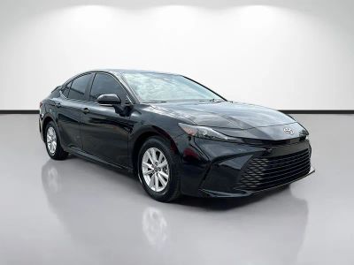 2025 Toyota Camry LE in Black — front three-quarter view