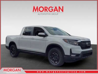 2025 Honda Ridgeline RTL+ in Platinum White Pearl — front three-quarter view