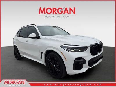 2023 BMW X5 M50i in White — front three-quarter view