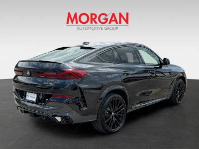 2027 BMW X6 — rear three-quarter view