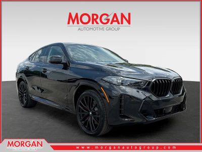 2027 BMW X6 xDrive40i in Black Sapphire Metallic — front three-quarter view