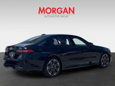 2027 BMW 5 Series — rear three-quarter view