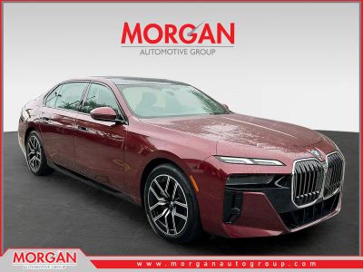 2025 BMW 7 Series 740i in Red — front three-quarter view