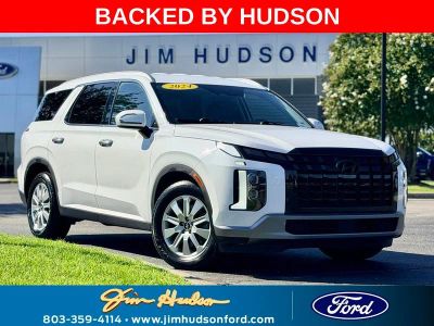 2024 Hyundai Palisade SEL 7 Passenger in White — front three-quarter view