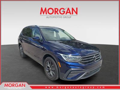 2023 Volkswagen Tiguan SE in Atlantic Blue Metallic — front three-quarter view