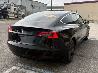 2019 Tesla Model 3 — rear three-quarter view