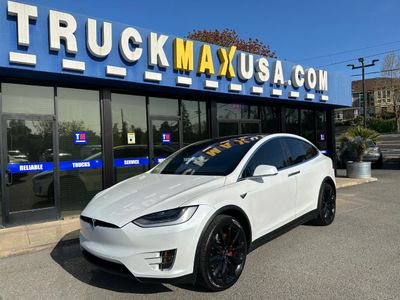 2020 Tesla Model X in White — front three-quarter view