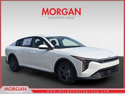 2026 Kia K4 LXS in Snow White Pearl — front three-quarter view
