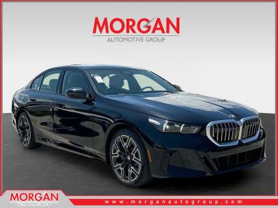 2027 BMW 5 Series 530i in Black Sapphire Metallic — front three-quarter view