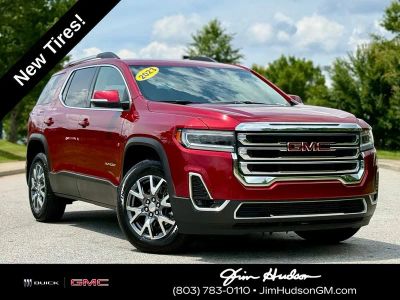 2023 GMC Acadia SLT in Volcanic Red — front three-quarter view