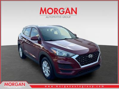 2019 Hyundai Tucson Value in Gemstone Red — front three-quarter view