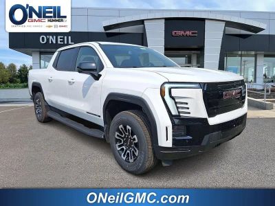 2026 GMC Sierra EV Elevation Standard Range in Summit White — front three-quarter view