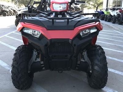 2026 Polaris Sportsman Touring 570 in INDY RED — front three-quarter view