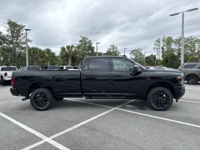 2026 RAM 3500 Laramie in Diamond Black Crystal Pearlcoat — front three-quarter view