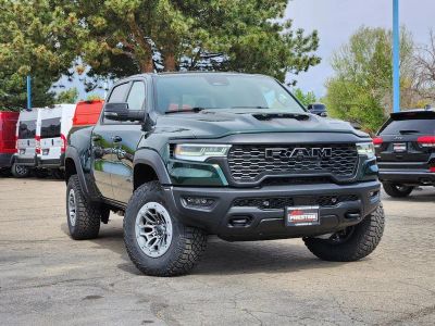 2026 RAM 1500 RAM 1500 RHO CREW CAB 4X4 5'7' BOX in Serrano-Green Metallic Exterior Paint — front three-quarter view