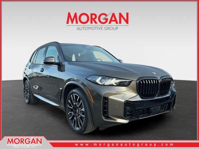 2026 BMW X5 xDrive50e in Manhattan Green Metallic — front three-quarter view