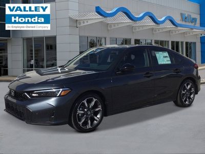 2026 Honda Civic Hatchback Hybrid Sport Touring in Meteorite Gray Metallic — front three-quarter view