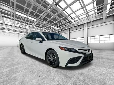 2023 Toyota Camry SE in White — front three-quarter view