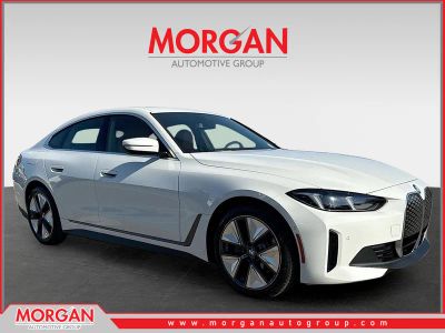 2026 BMW i4 eDrive40 in Alpine White — front three-quarter view