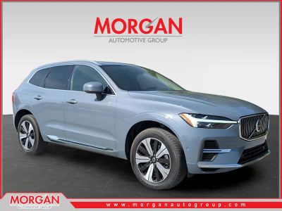 2023 Volvo XC60 Recharge Plug-In Hybrid T8 Plus Bright Theme in Blue — front three-quarter view