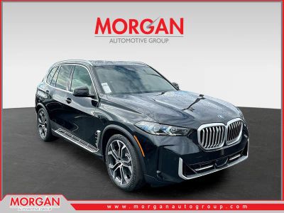 2026 BMW X5 xDrive50e in Black — front three-quarter view